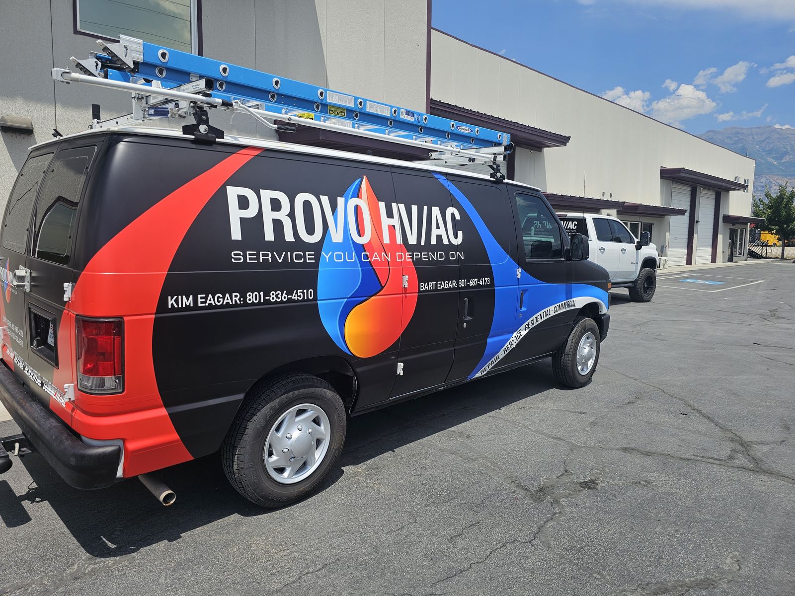 Provo HVAC service van with ladder rack, parked outside the shop